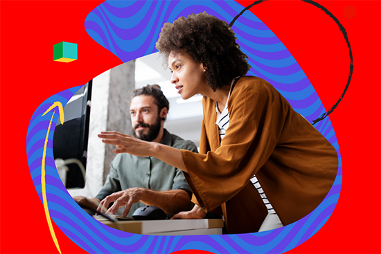 Woman and man next to each other looking at a computer screen.