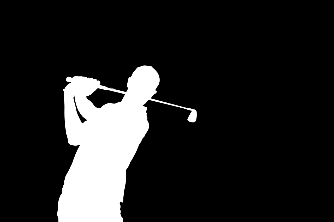 a mask of a person golfing with a black background