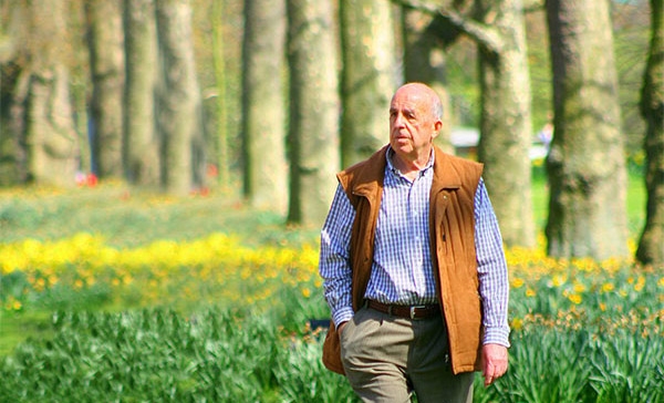 a picture of a person with a green scenic background