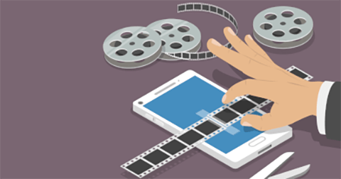 Stock illustration of a hand holding film